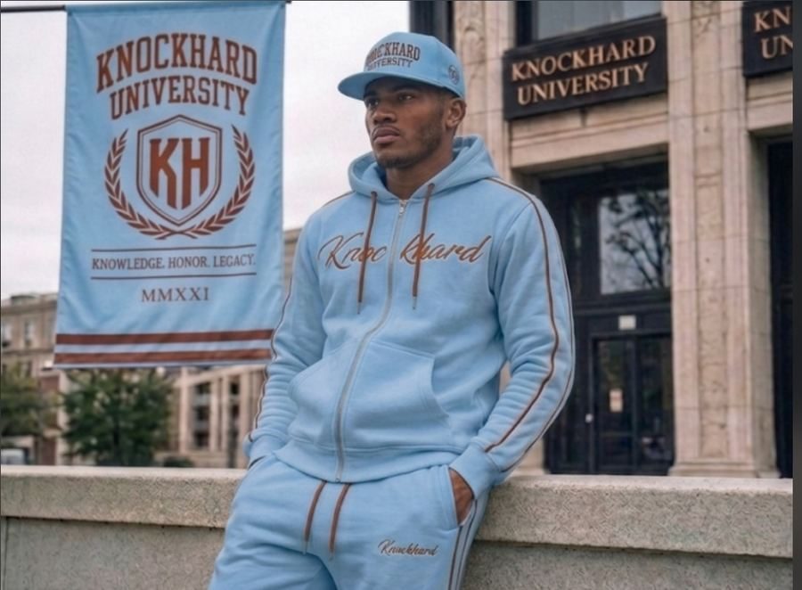 Model in the Daybreak blue Knockhard University full tracksuit and cap